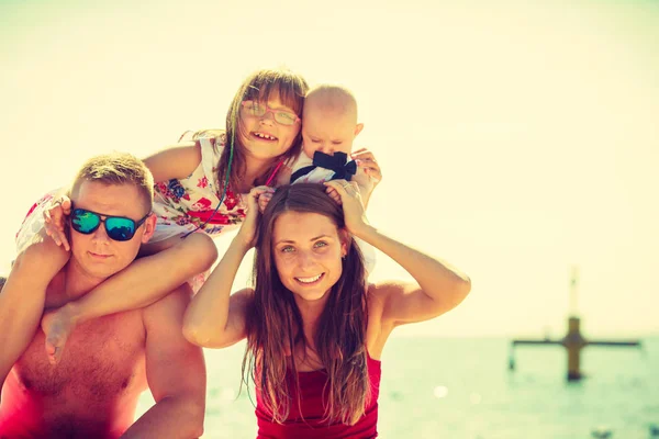 Family posing at beach near sea — Stock Photo, Image