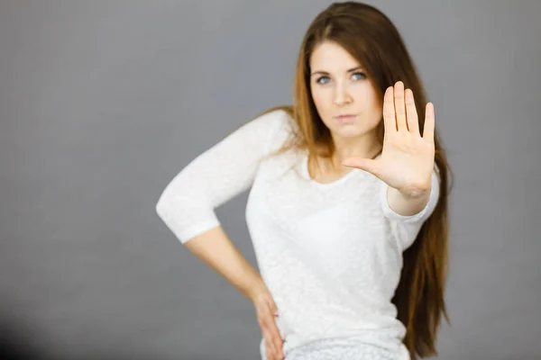 Angry apodicticity woman showing stop with hand — Stock Photo, Image