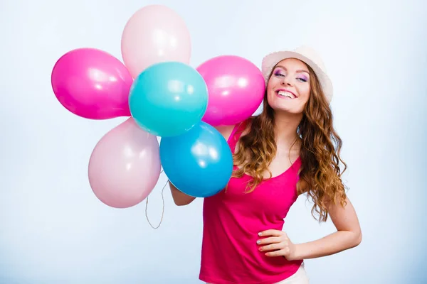 Woman playing with many colorful balloons — Stock Photo, Image