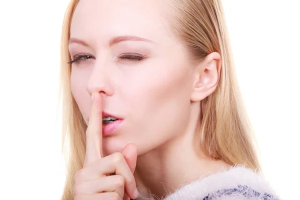 Young blonde woman making silence gesture — Stock Photo, Image