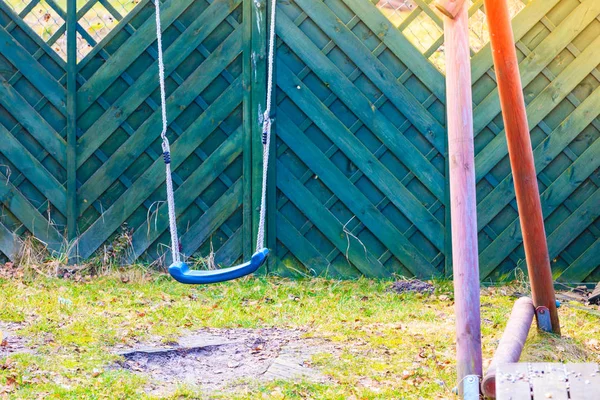 Simple, plastic swing for kids, outside shot. — Stock Photo, Image