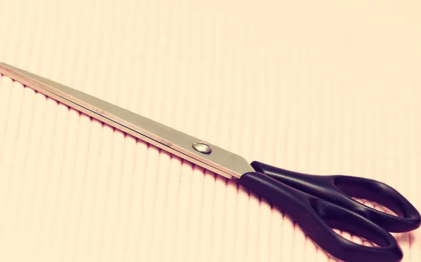 Detailed closeup of hairdressing scissors on pink background — Stock Photo, Image