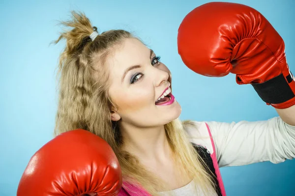 Funny girl in red gloves playing sports boxing — Stock Photo, Image