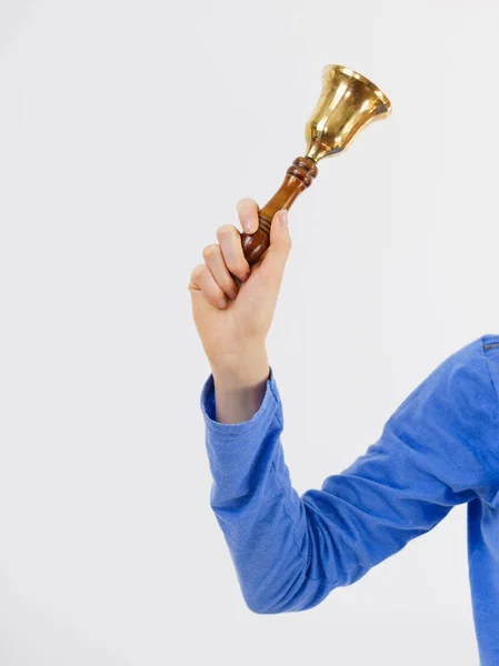 Woman hand holding small bell — Stock Photo, Image