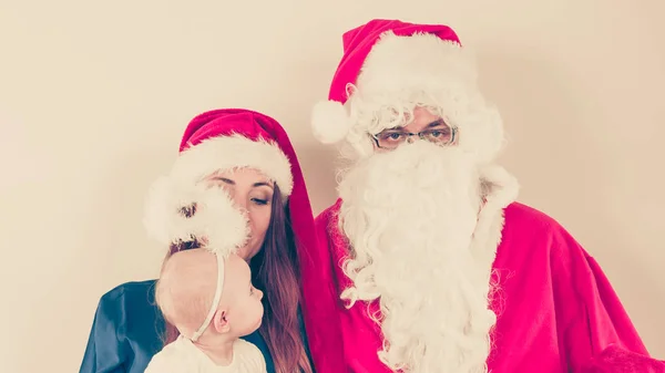 Santa Claus and woman with christmassy hat — Stock Photo, Image