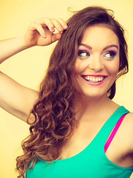 Portrait, young woman wearing colorful makeup and blue top — Stock Photo, Image