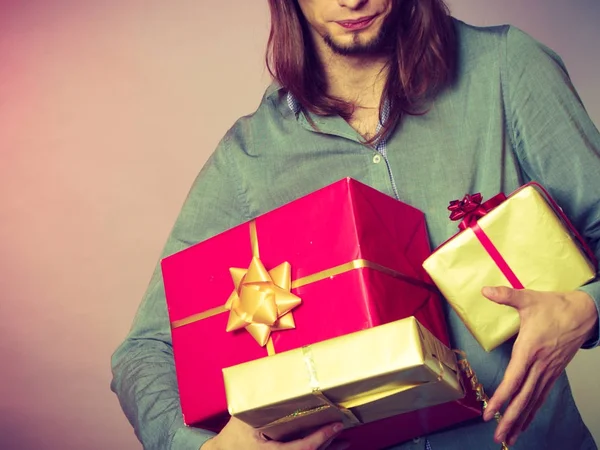 Guy with many presents gift boxes — Stock Photo, Image