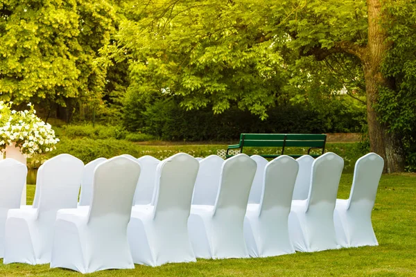 Many wedding chairs with white elegant covers — Stock Photo, Image