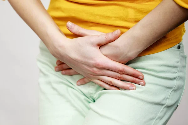 Woman with hands holding her crotch — Stock Image Woman with hands holding her crotch Stock Image