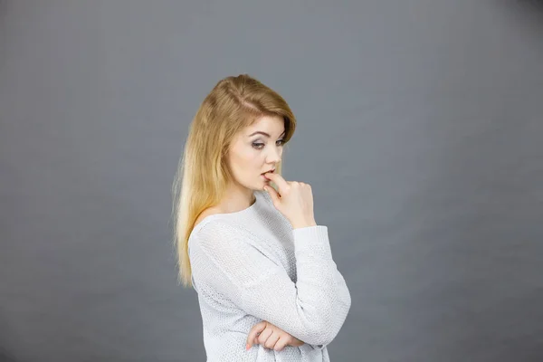 Blonde woman contemplating thinking about something — Stock Photo, Image