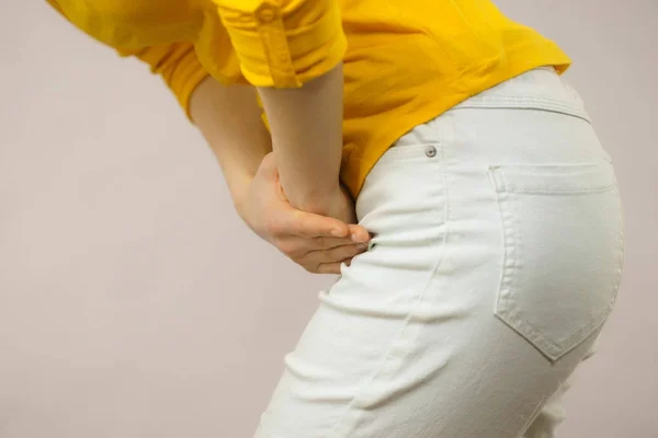 Woman with hands holding her crotch — Stock Image Woman with hands holding her crotch Stock Image
