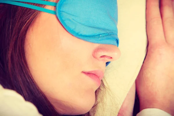 Brunette woman sleeping in blue eye sleep mask — Stock Photo, Image