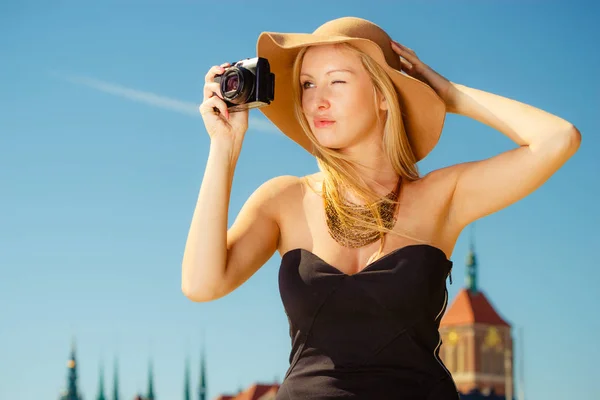 Beautiful elegant woman caught on taking pictures — Stock Photo, Image