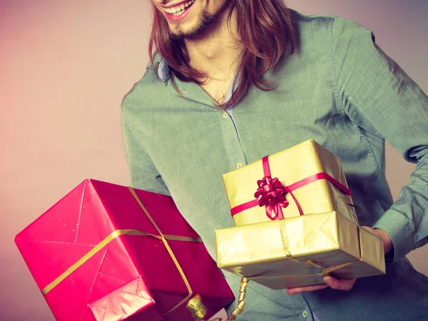 Guy with many presents gift boxes — Stock Photo, Image