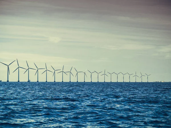 Wind turbines power generator farm along coast sea — Stock Photo, Image
