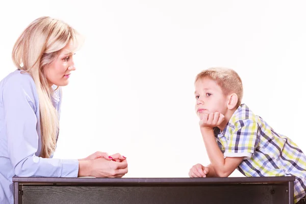 Mother and son talk and argue sit at table. — Stock Photo, Image