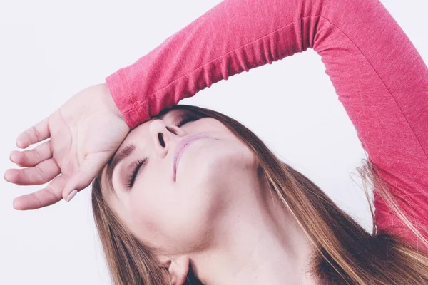 Young girl having her hand on forehead — Stock Photo, Image