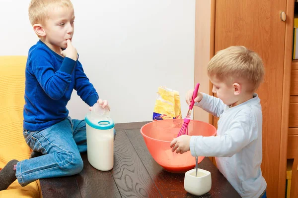 Two kid boys cooking, making cake in bowl — Stock Photo, Image