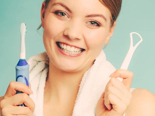 Girl with brush and tongue cleaner. — Stock Photo, Image
