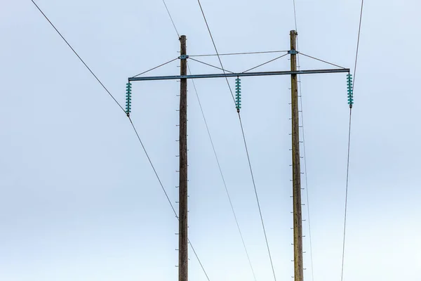 Postes de voltaje, pilón eléctrico, torre de transmisión de energía —  Fotos de Stock