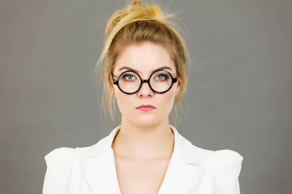 Bored focused college woman teacher wearing eyeglasses — Stock Photo, Image