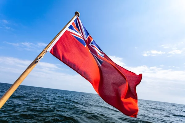 Uk red ensign the british maritime flag flown from yacht — Stock Photo, Image