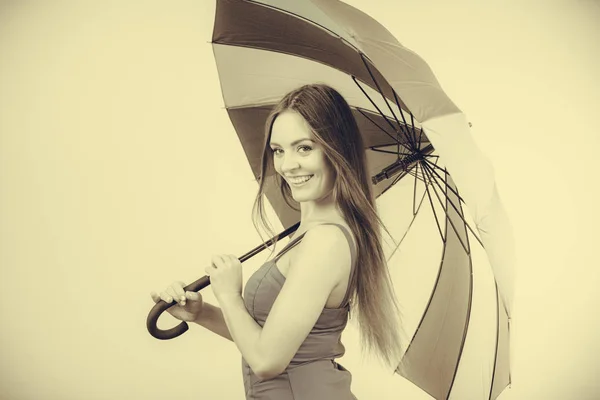 Woman in summer dress holds umbrella — Stock Photo, Image