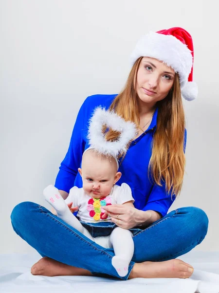 Christmas woman with cute baby. — Stock Photo, Image