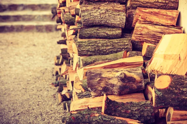 Firewood, pile of wood standing outside — Stock Photo, Image