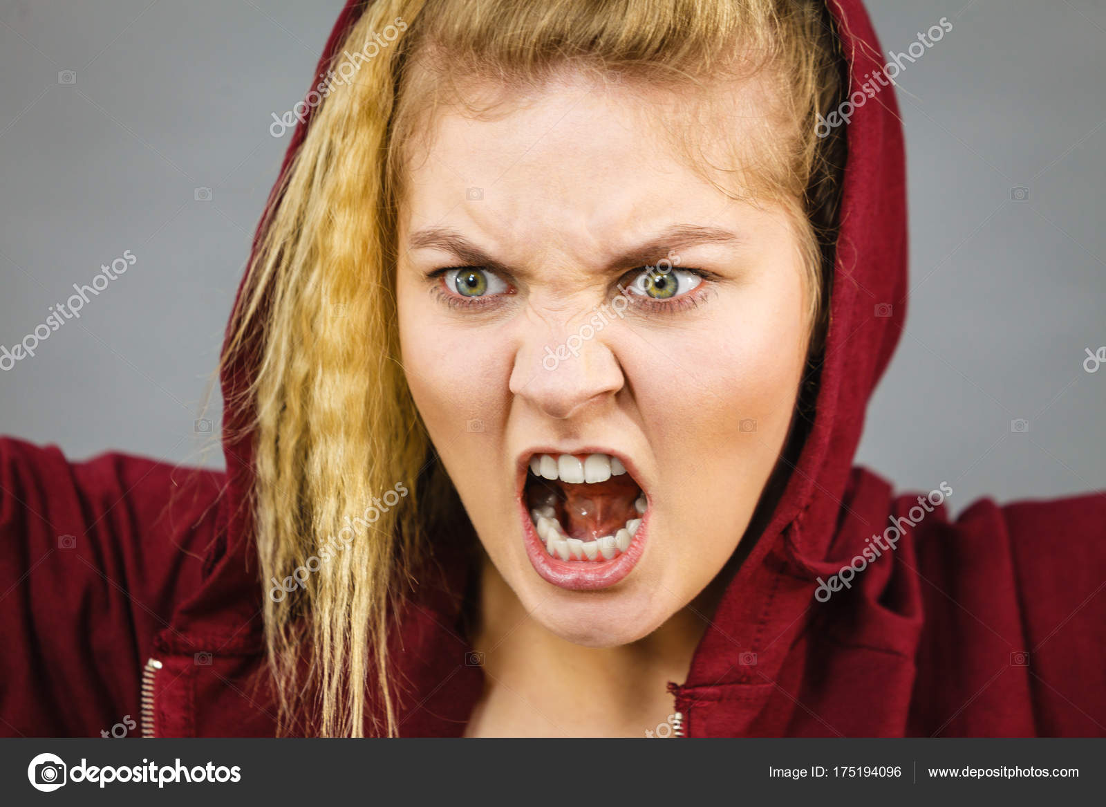 Angry sporty woman screaming Stock Photo by ©Voyagerix 175194096