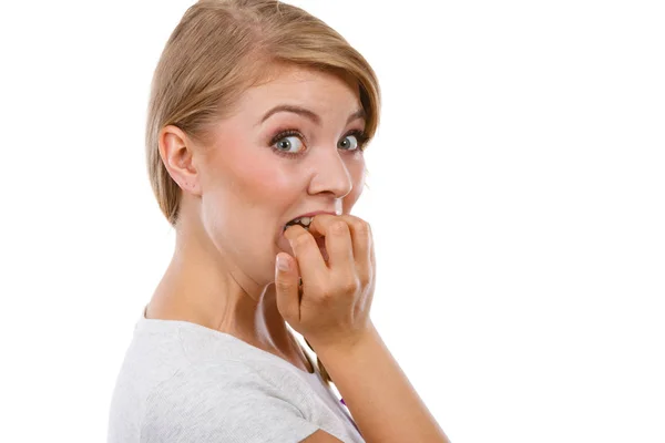 Scared, stressed woman biting her nails — Stock Photo, Image
