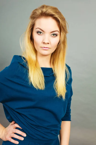 Portrait blonde young woman having serious face expression — Stock Photo, Image