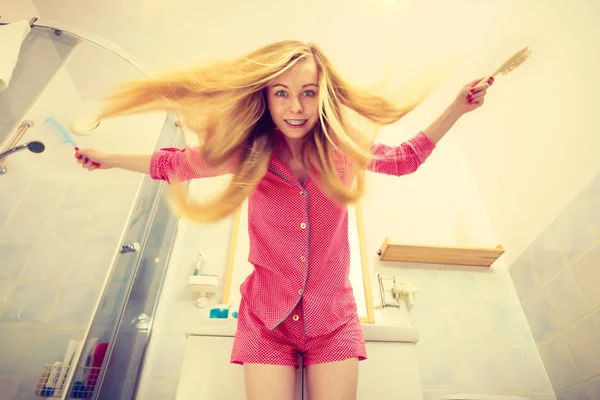 Woman with long windblown blonde hair — Stock Photo, Image