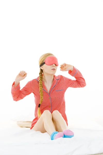 Sleepy woman wearing pink eye band — Stock Photo, Image