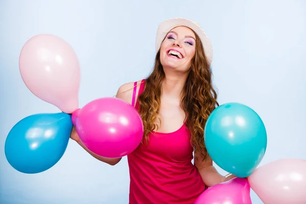 Woman playing with many colorful balloons — Stock Photo, Image