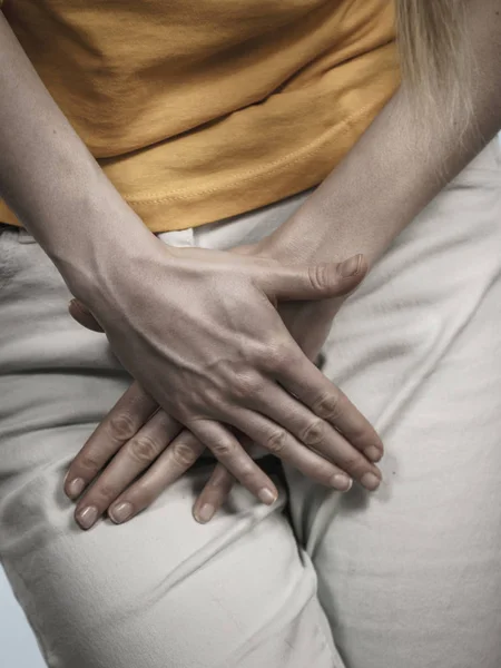 Woman with hands holding her crotch — Stock Image Woman with hands holding her crotch Stock Picture