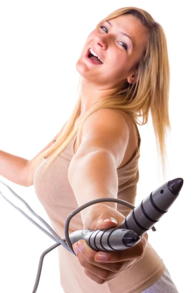 Happy blonde woman holding skipping rope — Stock Photo, Image