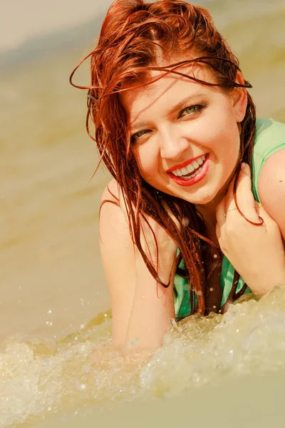 Redhead woman posing in water during summertime — Stock Photo, Image