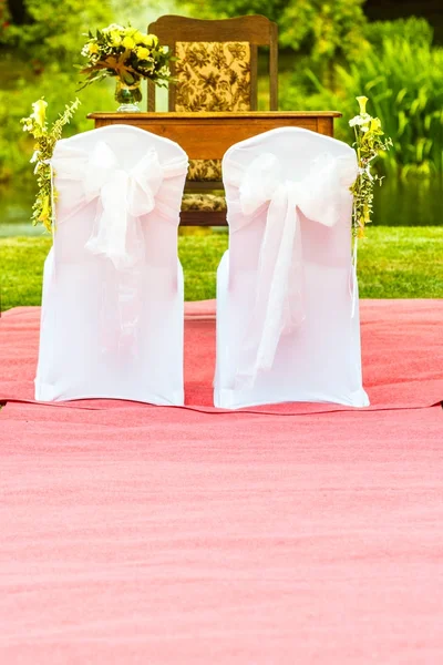 Two wedding chairs with white elegant covers — Stock Photo, Image