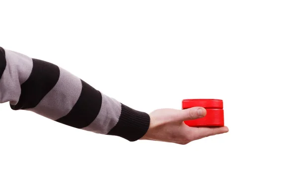 Man holds heart shaped gift box in hand — Stock Photo, Image