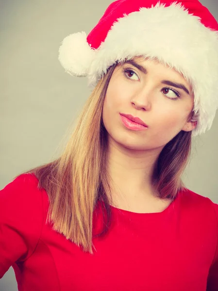Thinking woman wearing Santa Claus helper costume — Stock Photo, Image