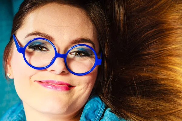 Young woman face in blue glasses — Stock Photo, Image