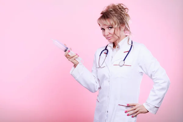 Nurse with big syringe. — Stock Photo, Image