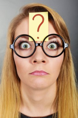 Weirdo nerd woman having question mark on forehead clipart