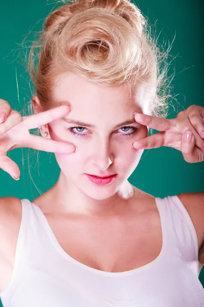 Woman with fingers close to eyes — Stock Photo, Image