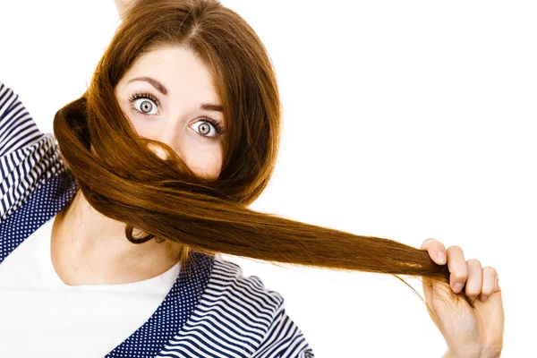 Woman having face covered with her brown hair — Stock Photo, Image