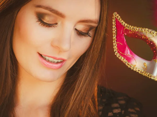 Woman holds carnival mask closeup — Stock Photo, Image