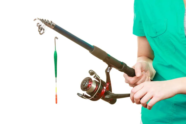 Person holding fishing rod, spinning equipment. — Stock Photo, Image