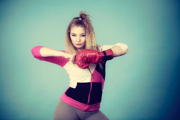 Funny girl in red gloves playing sports boxing — Stock Photo, Image