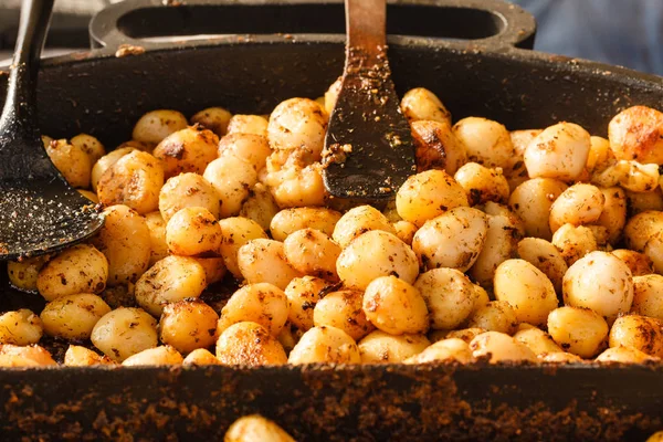 Backed young potatoes with spices in bowl — Stock Photo, Image